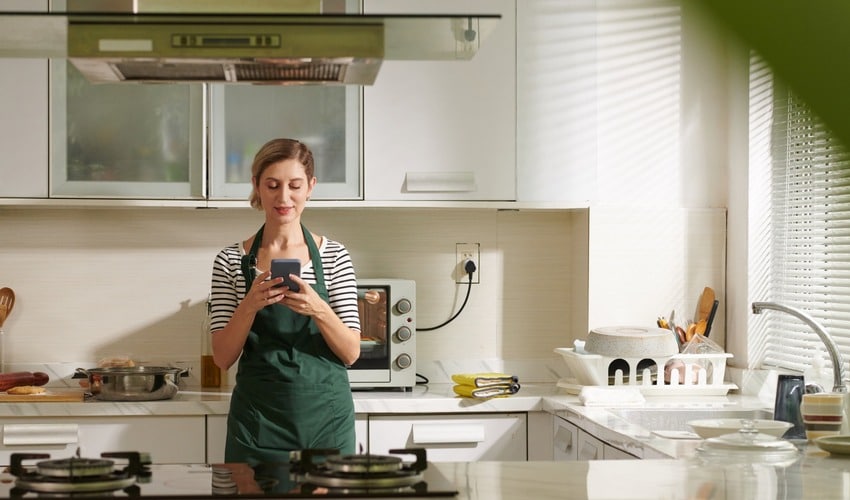 10 Million Recipes 5 10 Million Recipes - woman looking up recipes in her kitchen